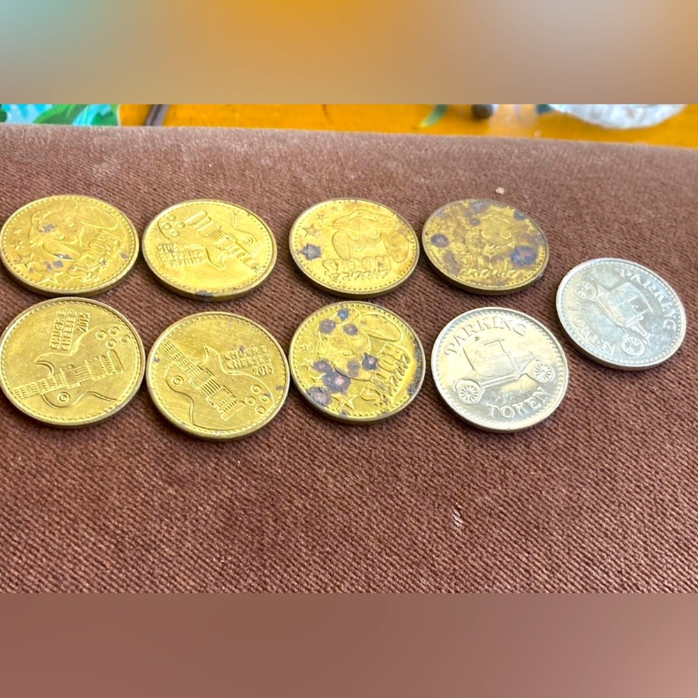 9 collectible coins. Chuck E Cheese and parking token.
